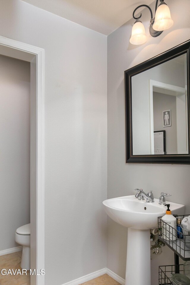 44927 Normandy Ln, Lancaster, CA 93536 - half bathroom featuring toilet and a sink