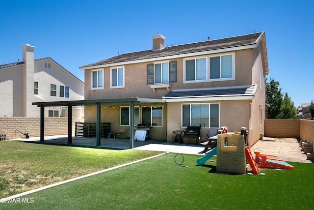 44927 Normandy Ln, Lancaster, CA 93536 - back of house featuring a fenced backyard, stucco siding, and a patio