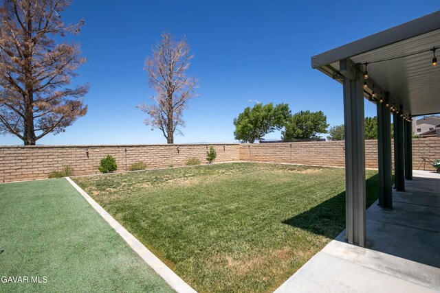 44927 Normandy Ln, Lancaster, CA 93536 - fenced backyard featuring a patio