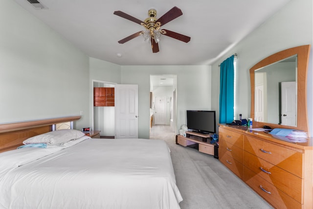 bedroom featuring ceiling fan and light colored carpet