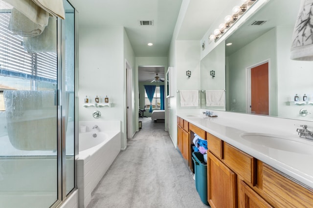 bathroom with ceiling fan, a healthy amount of sunlight, vanity, and separate shower and tub