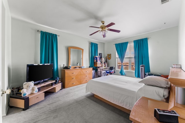 bedroom featuring light colored carpet and ceiling fan