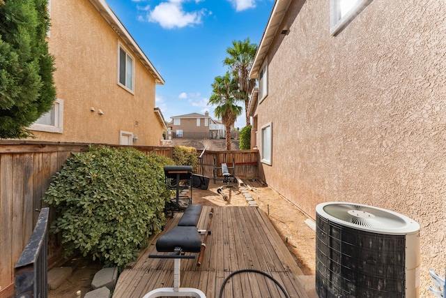 wooden terrace featuring central AC unit