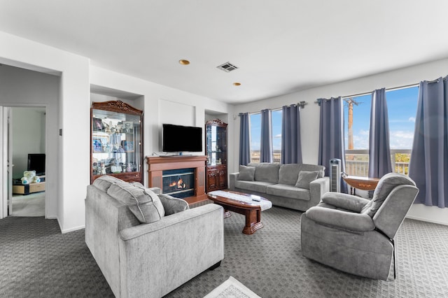 carpeted living room featuring plenty of natural light