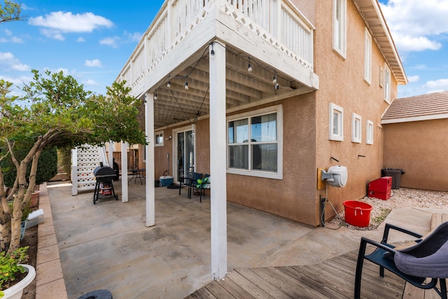 view of patio / terrace featuring area for grilling and a wooden deck