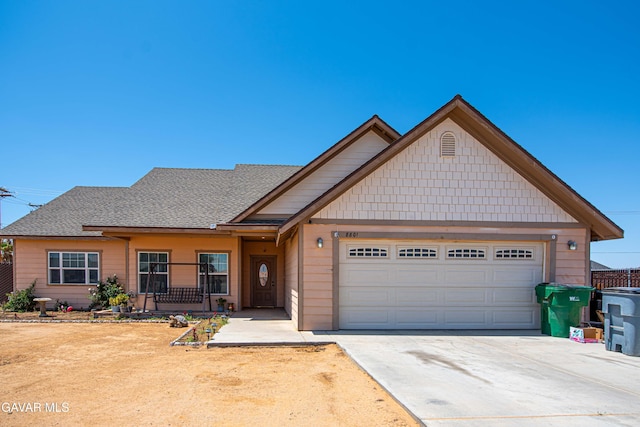 8801 Lupine Loop Dr, California City, CA 93505 - view of front facade featuring an attached garage, concrete driveway, and roof with shingles