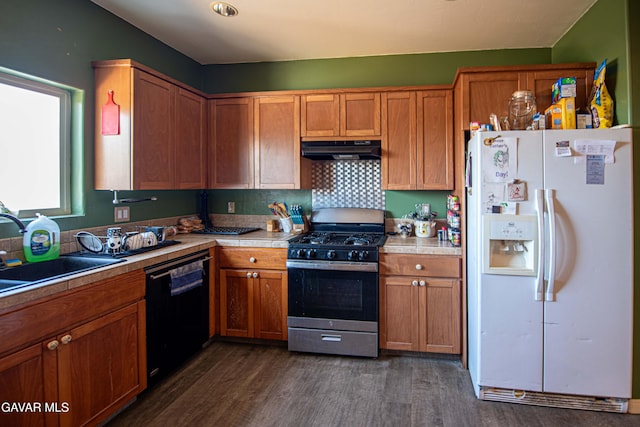 8801 Lupine Loop Dr, California City, CA 93505 - kitchen featuring white refrigerator with ice dispenser, stainless steel gas stove, black dishwasher, under cabinet range hood, and dark wood-type flooring