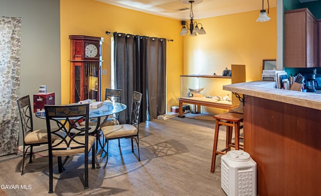8801 Lupine Loop Dr, California City, CA 93505 - dining area featuring wood finished floors and a chandelier