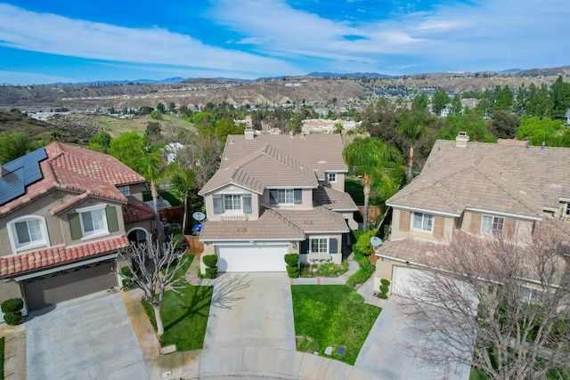 drone / aerial view featuring a mountain view and a residential view