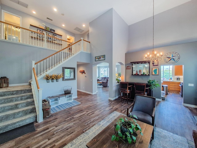 living area featuring plenty of natural light, baseboards, and wood finished floors