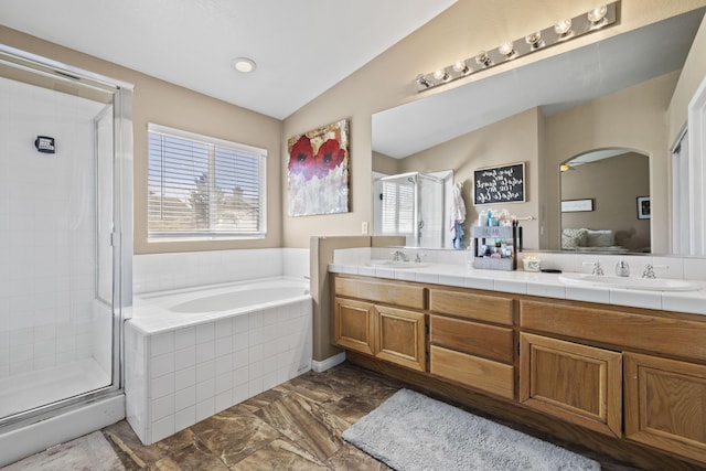 bathroom with separate shower and tub, vanity, and lofted ceiling