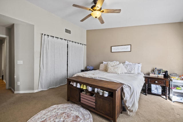 carpeted bedroom with ceiling fan