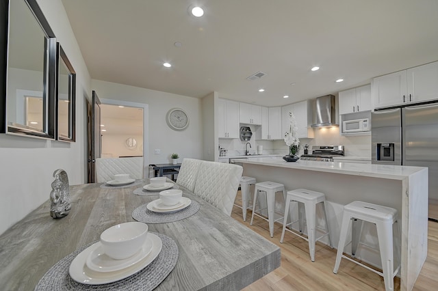 12871 W Osborne St, Arleta, CA 91331 - dining room featuring light wood-type flooring and recessed lighting