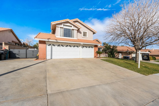 front of property featuring a garage and a front yard