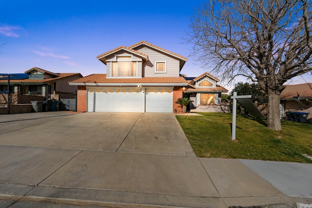 view of property with a garage and a front yard