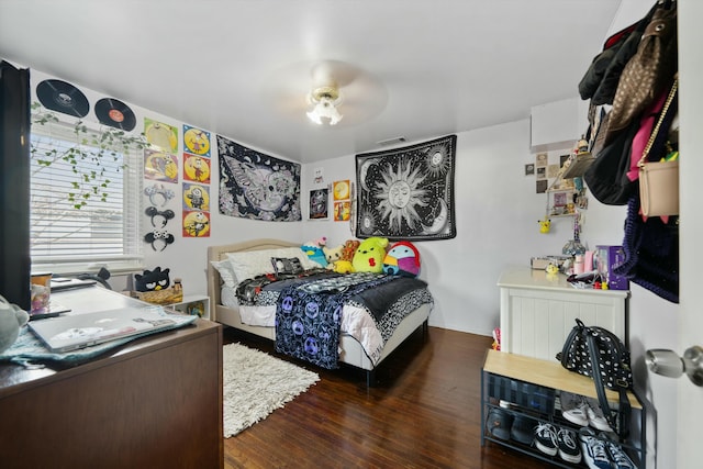 bedroom featuring dark hardwood / wood-style floors and ceiling fan