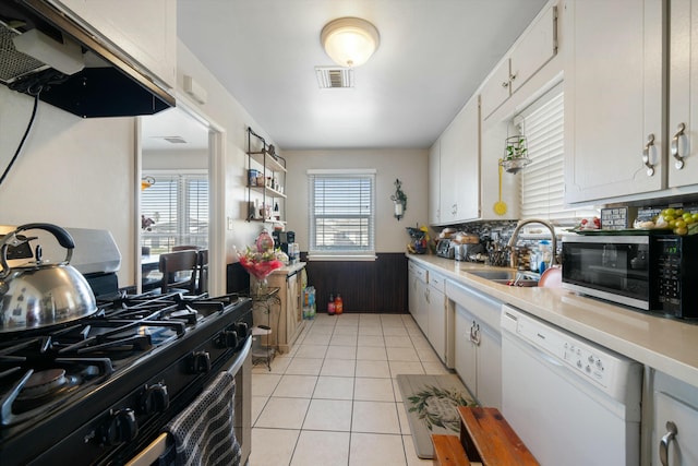 kitchen featuring white cabinets, dishwasher, sink, and stainless steel gas range