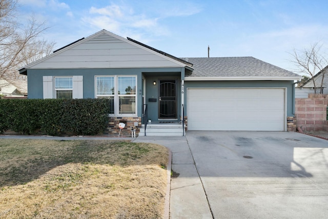 single story home featuring a front yard and a garage