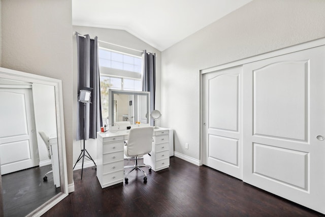 office with dark wood-type flooring and vaulted ceiling