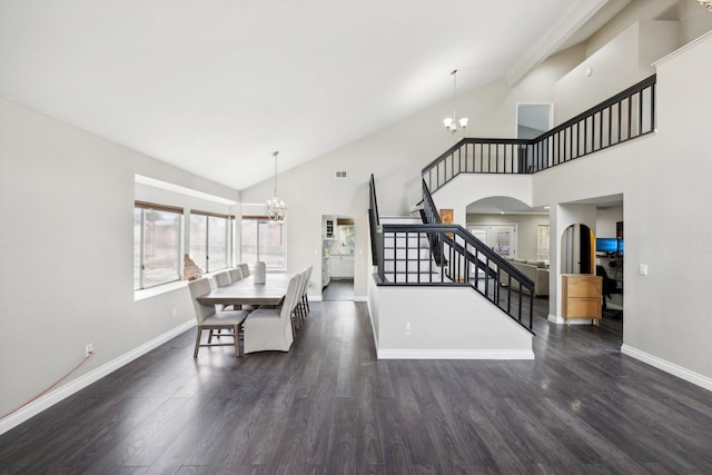 dining room with dark hardwood / wood-style flooring, high vaulted ceiling, and a notable chandelier