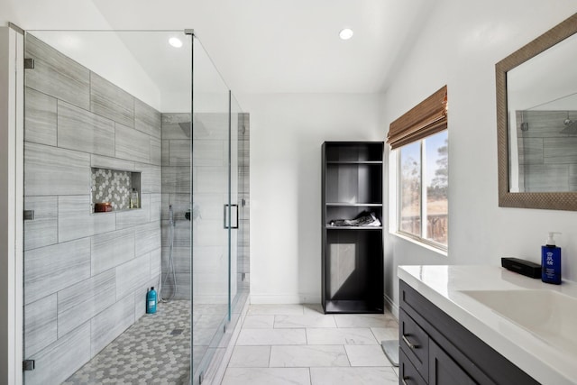 bathroom featuring vanity and walk in shower