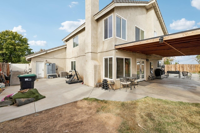 back of house featuring a patio area and cooling unit