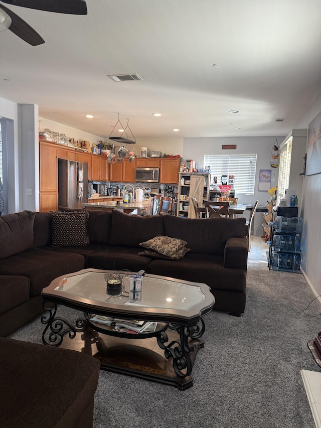 living room featuring a ceiling fan, carpet, visible vents, and recessed lighting