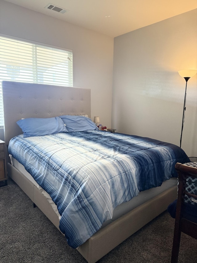 bedroom with carpet floors and visible vents