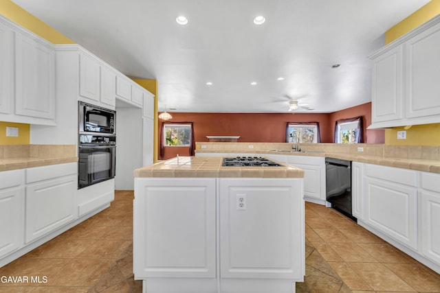 8433 Prospect St, Mojave, CA 93501 - kitchen with black appliances, tile counters, recessed lighting, a peninsula, and a ceiling fan