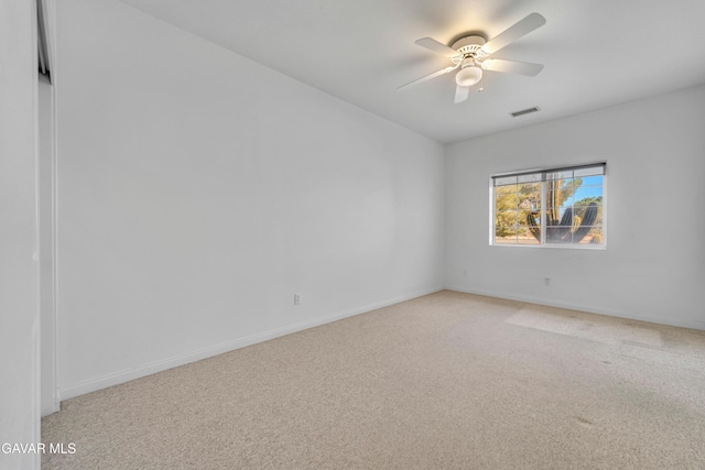 8433 Prospect St, Mojave, CA 93501 - spare room featuring light carpet and a ceiling fan