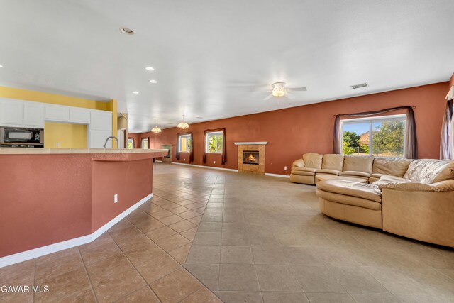 8433 Prospect St, Mojave, CA 93501 - living room with a ceiling fan, light tile patterned flooring, and recessed lighting
