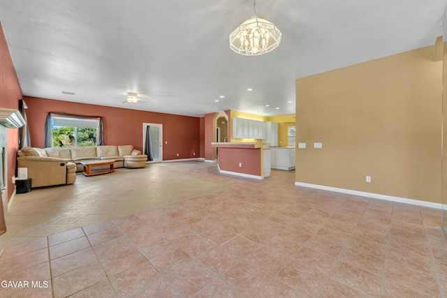 8433 Prospect St, Mojave, CA 93501 - unfurnished living room with a chandelier, ceiling fan, light tile patterned flooring, and recessed lighting