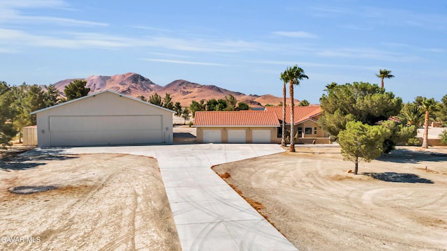 8433 Prospect St, Mojave, CA 93501 - view of front facade featuring a tile roof and a mountain view