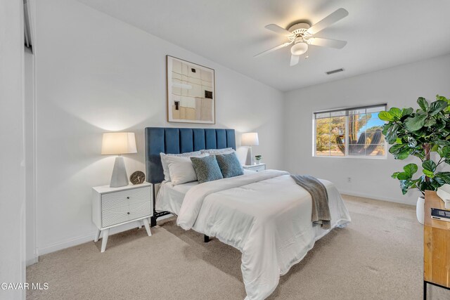 8433 Prospect St, Mojave, CA 93501 - carpeted bedroom with baseboards and ceiling fan