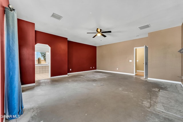 8433 Prospect St, Mojave, CA 93501 - unfurnished room featuring unfinished concrete floors, a ceiling fan, and arched walkways