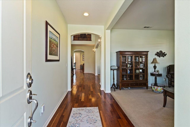 hallway featuring dark wood-type flooring