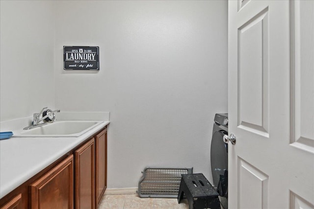 washroom with cabinets, light tile patterned flooring, and sink