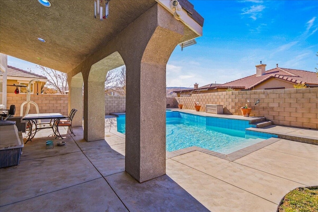 view of pool featuring a patio