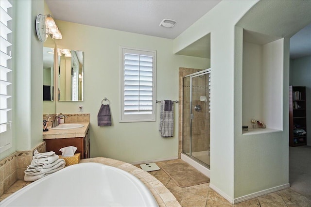 bathroom with tile patterned flooring, vanity, and separate shower and tub