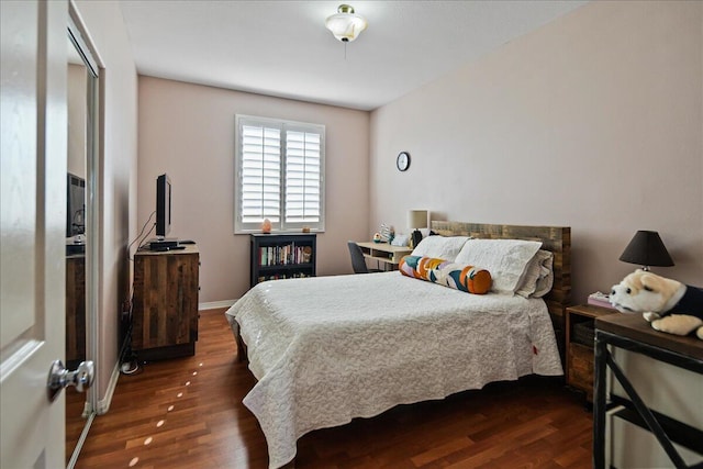 bedroom featuring dark hardwood / wood-style floors