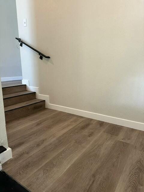 staircase featuring hardwood / wood-style floors