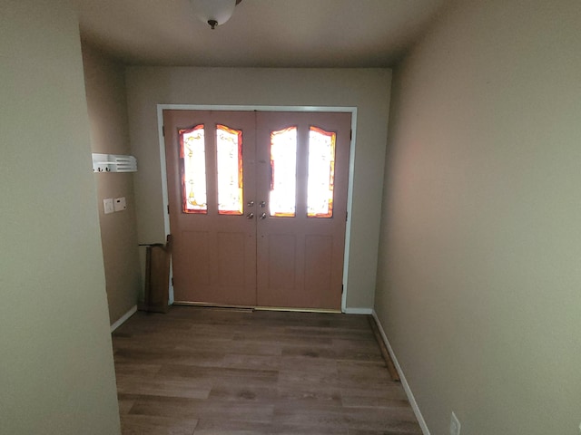 doorway to outside with hardwood / wood-style flooring and french doors