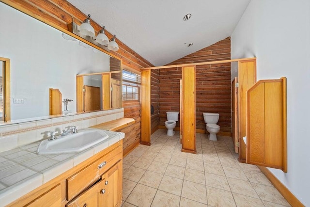 bathroom with vanity, wooden walls, toilet, and lofted ceiling