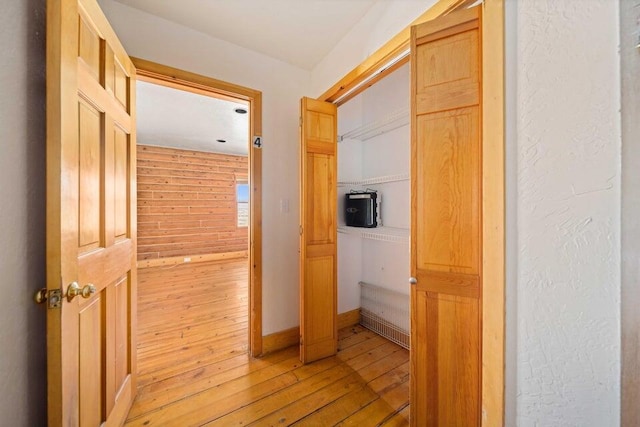 hall with light hardwood / wood-style floors