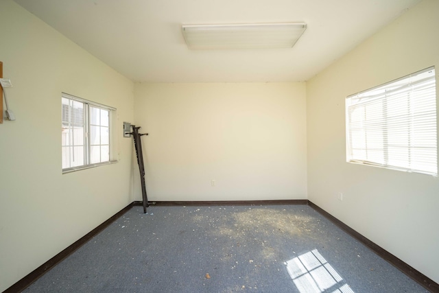 spare room featuring a wealth of natural light