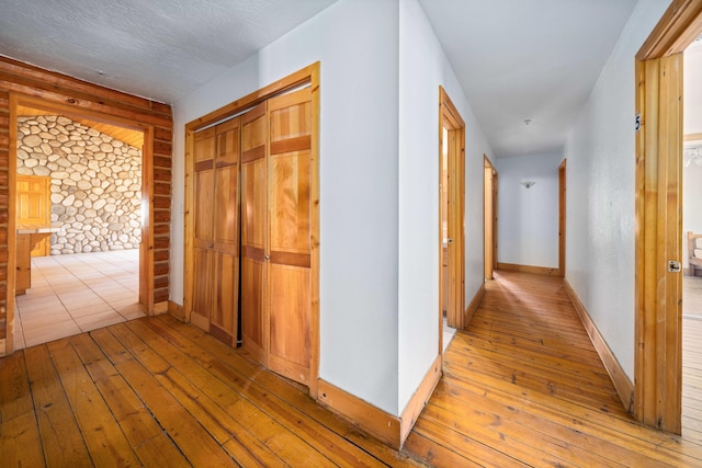 hall with light hardwood / wood-style floors