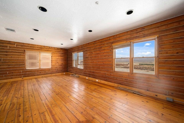 empty room with wood-type flooring