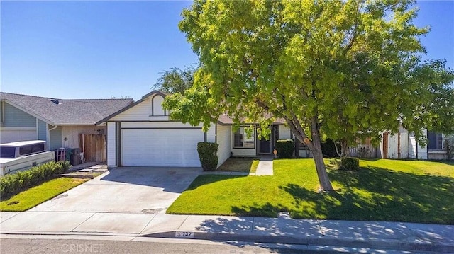 view of front of home featuring a garage and a front lawn