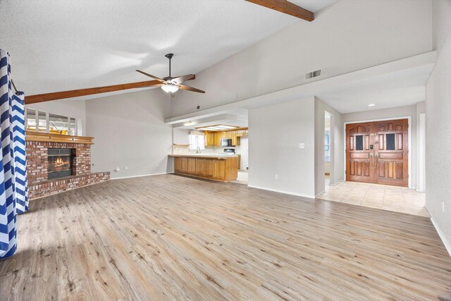 1086 Hickory Ave, Tehachapi, CA 93561 - unfurnished living room featuring baseboards, a ceiling fan, visible vents, and light wood-style flooring