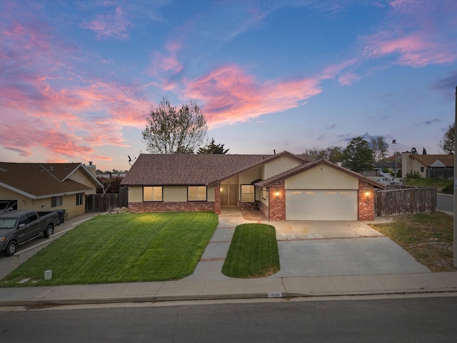 1086 Hickory Ave, Tehachapi, CA 93561 - single story home with fence, a front lawn, concrete driveway, an attached garage, and brick siding